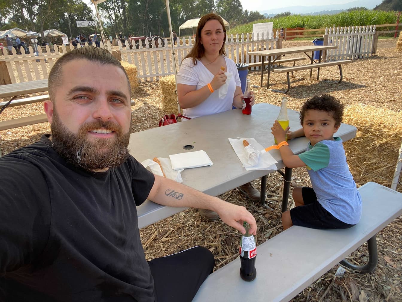 Cem and family on a park bench